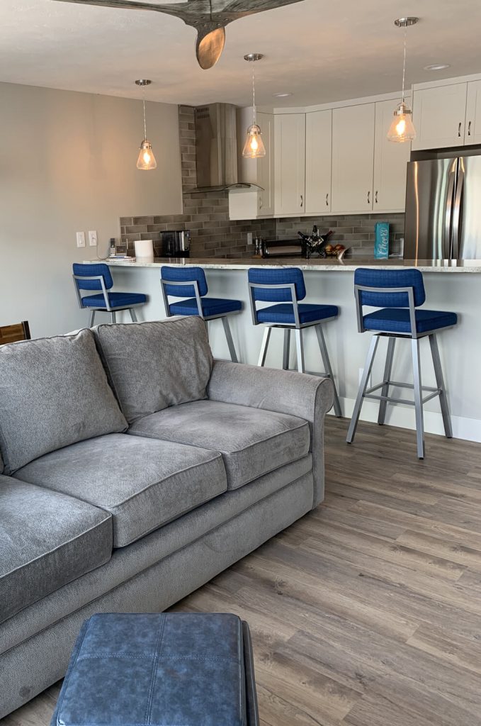 Amisco's Phoebe Upholstered Urban Modern Swivel Metal Bar Stools in Modern Kitchen Show in Blue Fabric