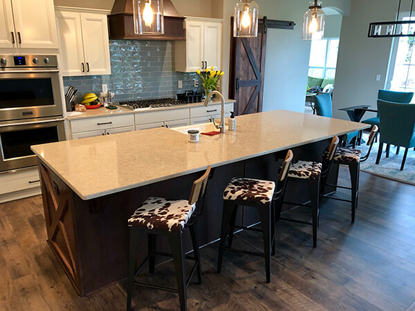 Amisco's Upright Metal Counter Stool with Wood Back, Cowhide Seat Cushion Pattern - Shown in Farmhouse Country Kitchen