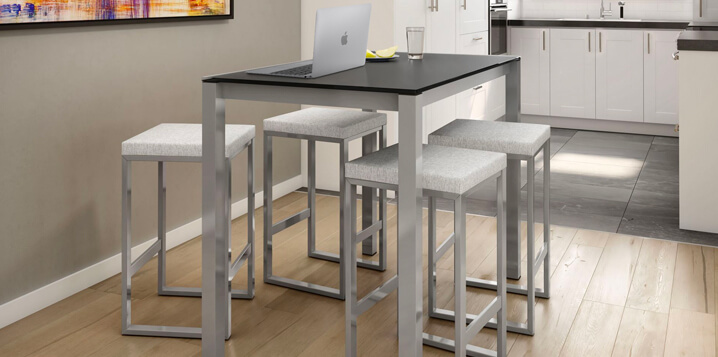 Backless bar stools near laptop setting