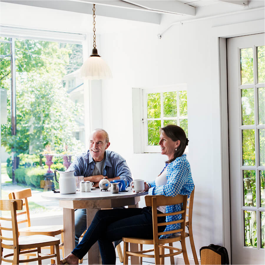 Two people enjoying sunroom