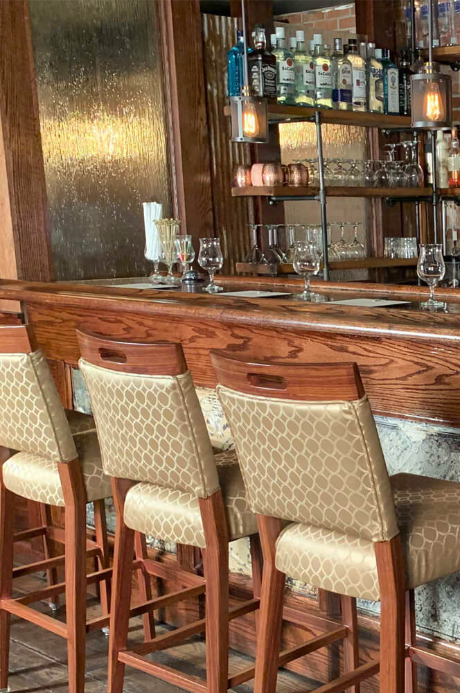 IH Seating Charlotte Transitional Wood Grain Bar Stools in Bar Restaurant