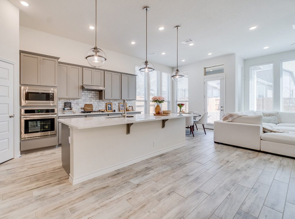 Empty brown kitchen with no bar stools