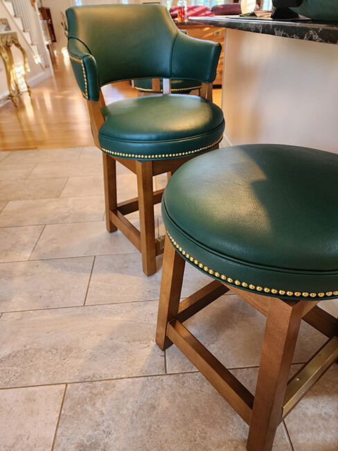 Style Upholstering Wood Swivel Bar Stools with Green Vinyl and Nailhead Trim in Customer's Home