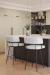 Amisco's Enya Black and White Low Back Swivel Bar Stools in Modern Kitchen