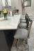 Holland's Catalina Stainless Steel Swivel Bar Stools in Modern White Kitchen