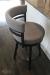 Amisco's Ronny Swivel Counter Stool on Hardwood Floor